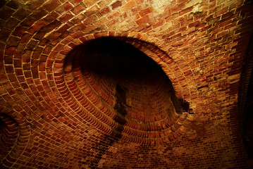 Inside old sewer. Brick construction