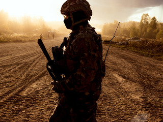 Tanks at firing positions. A soldier on the battlefield. Sandstorm. Storm.