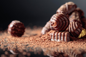 Chocolate candies sprinkled with chocolate chips.