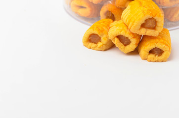 Pineapple roll tart cookies known as Tat Nenas isolated on white background. Modern cookies for Hari Raya Aidilfitri (Eid UI-Fitr) celebration. Pineapple tart isolated.