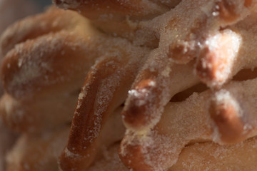closeup on Mexican traditional Sweet Bread. Closeup of sweet sugary bread typically prepared for day of the dead celebration, a Mexican Halloween when offerings are made to ancestors.