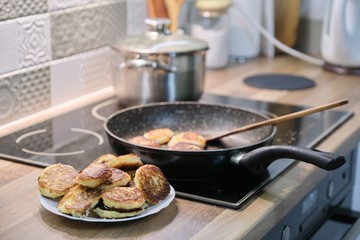 Homemade food, process of cooking frying in pan of cheesecakes, curd pancakes