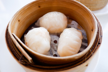 Chinese dumpling in a bamboo steamer box