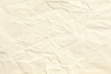 Old pale yellow crumpled paper background texture