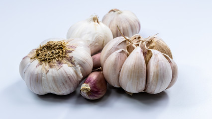 Garlic is food and medicinal plants. Placed on a white background