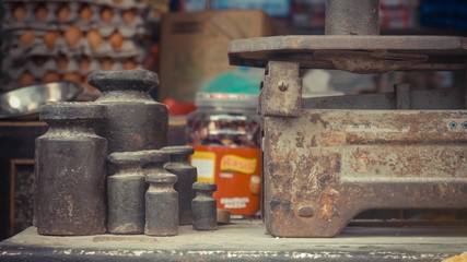 Organised black pot next to rusty metal pot