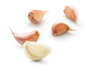 Garlic white background. Garlic cloves on white. Garlic clove isolated. Peeled, unpeeled garlic cloves.