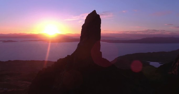 Stunning sunrise at Old Man Storr, Isle of Skye. Sun blocked out by rocks in beautiful panning shot