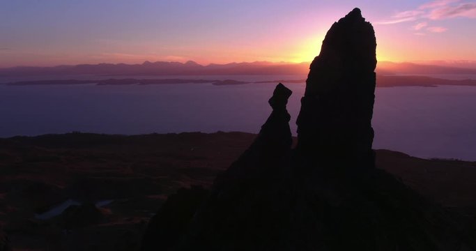 Old Man Storr silhouetted at sunrise, stunning rock formations on Isle of Skye, Scotland