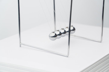 balancing balls pack of sheets of paper. business concept. Newtons Cradle