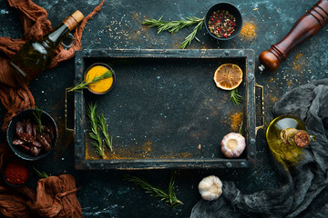 Black stone cooking banner. Spices and herbs. Top view.