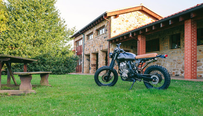 Beautiful vintage custom motorcycle parked on the grass