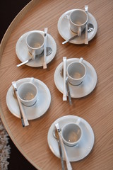 Empty cups of coffee on a wooden table