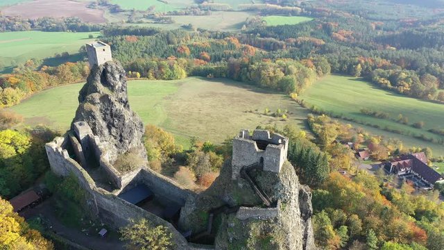 Impressive autumn landscape of Bohemian Paradise overlooking ruins of medieval Trosky Castle on tops of two stone crags, Czech Republic
