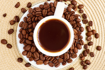Cup with coffee beans in bulk coffee