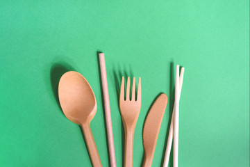 Zero waste kitchenware on the green background.