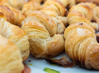 Close up croissant puff pastry, you can see all the layers and the crunchiness of the dough