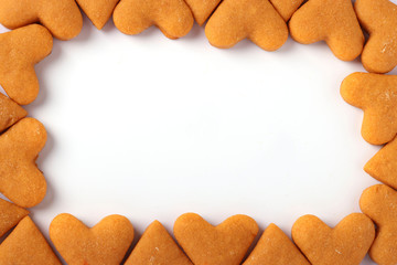 Heart cookies laid out in the form of a frame on a white background. Concept for Valentine's day or Good morning, Top view