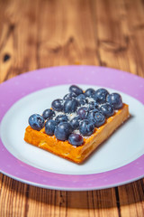 Sweet Homemade waffles with fresh blueberries