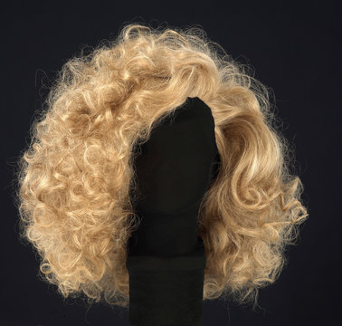 Long Blonde Hair Wig Isolated On Black Background