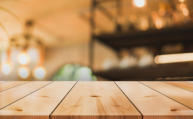 Empty old wood table top with bokeh coffee shop interior background