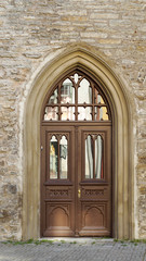 Old textured color wooden door in Paris