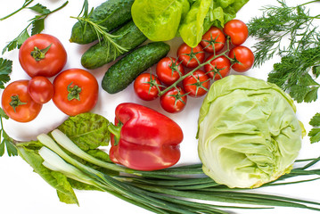 different types of vegetables on a white background top view. vegan products. peppers, cabbage, tomatoes, cucumbers, various herbs. vegetable diet.