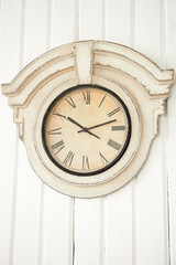antique clock on wooden wall