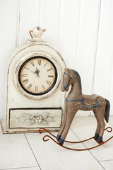 antique clock on a wooden background