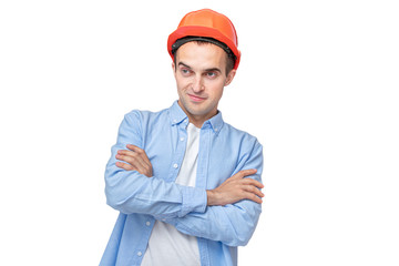 Builder in helmet looks away, man smirking, isolated background, copy space