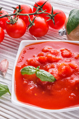 juicy canned tomatoes on wooden rustic background