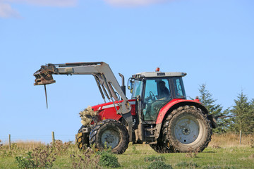 Fototapeta na wymiar Tractor working in a field