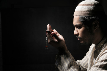 muslim man praying during ramadan at night 