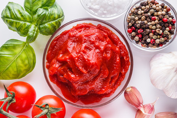 fresh natural tomato paste on a white background
