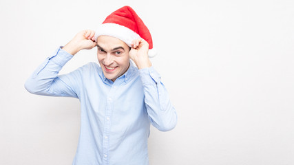 Handsome man wears a Santa Claus hat, portrait, white background, copy space, 16:9