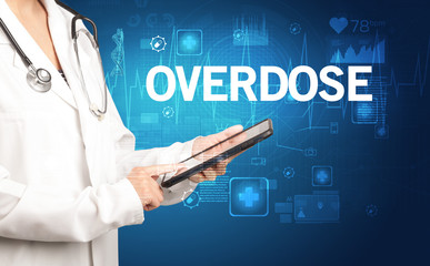 young doctor writing down notes with OVERDOSE inscription, healthcare concept