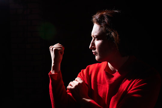 Emotional portrait of middle age woman on black background. Female model gets angry while posing in the Studio