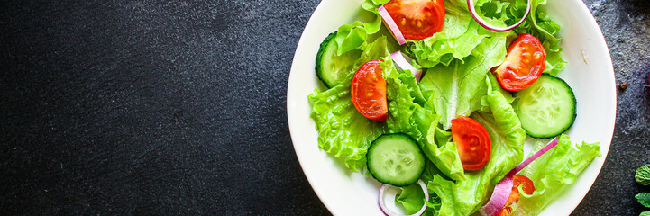 healthy salad (tomato, cucumber, mix leaves other ingredients) top menu concept. food background. copy space keto or paleo diet