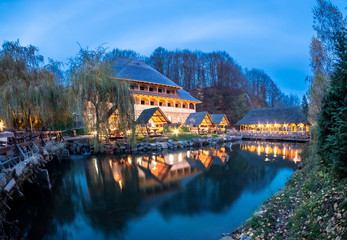 Lake and house architecture at night in Sighetu Marmatiei, Maramures - Romania
