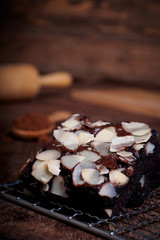 Chocolate brownies on a wooden table served