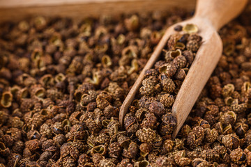 fragrant Sichuan pepper on white acrylic background