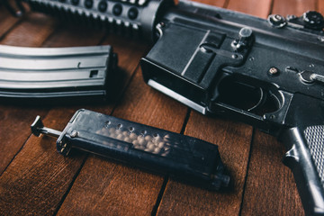 loader airsoft rifle lying next to the foreground