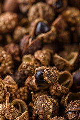 fragrant Sichuan pepper on white acrylic background