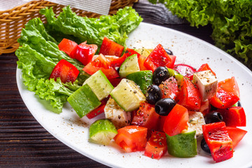 greek salad on dark wooden rustic background