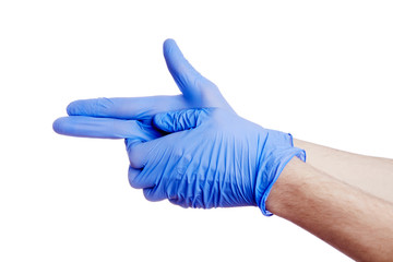 Gros plan main portant un gant en latex bleu de protection médicale anti-virus faisant un geste de...