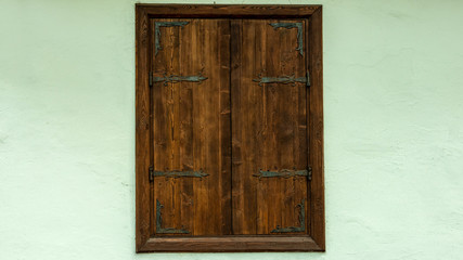 Old wooden window in medieval style