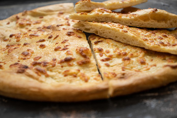 Tortilla with cheese on a dark background