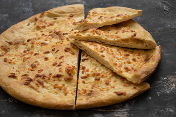 Tortilla with cheese on a dark background