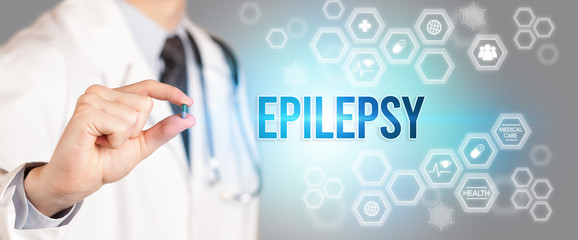 Close-up of a doctor giving you a pill with EPILEPSY inscription, medical concept