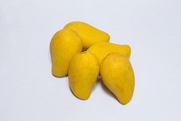 Bunch of yellow sweet mangoes on white background